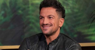 Peter Andre looks unrecognisable with long black hair as he unveils startling new look