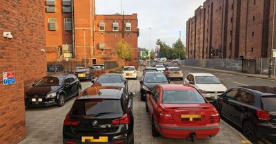 Drivers criticised after dozens of cars spotted blocking pavement yards from 'no parking' sign