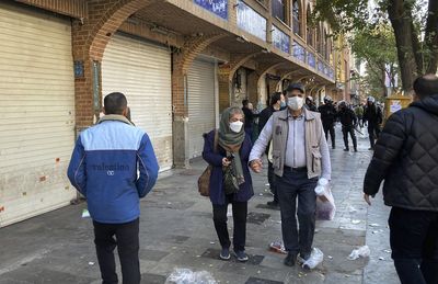 Children among dead as Iran sees large protests, strikes