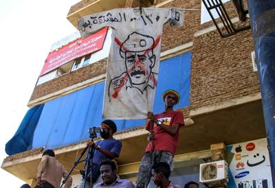 Sudanese officers fire tear gas as thousands protest coup