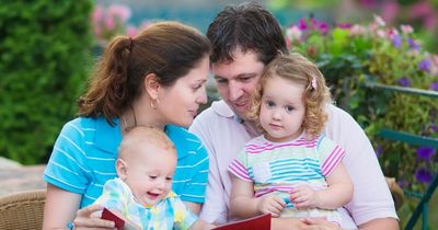 Tired mum with screaming baby handed dustpan and brush to clean up baby’s 'mess' before leaving cafe