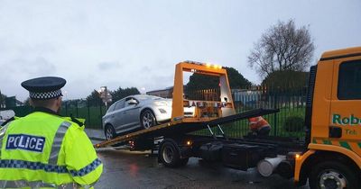 Police tow away car at Liverpool school with parking issues