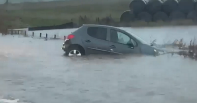 Cars trapped in floods across Scotland as rain batters east coast