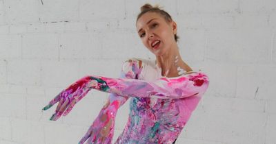 Woman makes thousands covering herself in paint and dancing on canvases