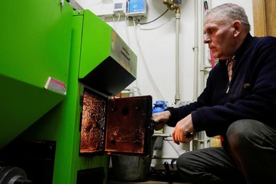 Lithuanian farmer burns grain for heat as cheaper than burning wood