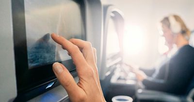 Mum shouts at passenger watching gory film on flight that left her son in tears