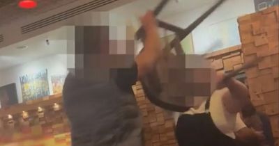 Nando's fight erupts as couple battle with chair in front of diners and young children