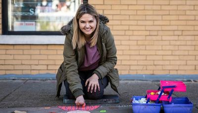 She lost four fingers in a car crash. It hasn’t stopped her from creating beautiful sidewalk art