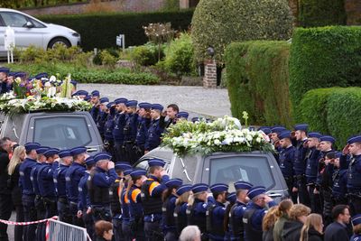 Thousands of Belgian police line streets for funeral of murdered colleague