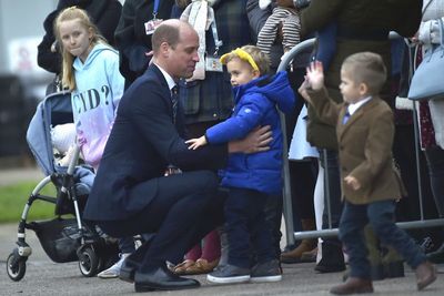 Prince of Wales hugs little boy and promises to put picture on his fridge