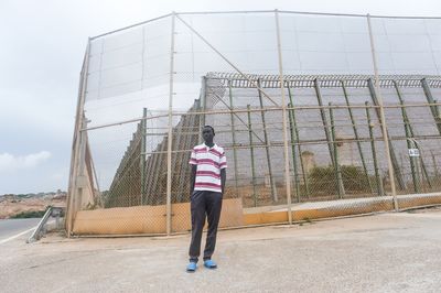 Dozens died trying to cross this fence into Europe in June. This man survived