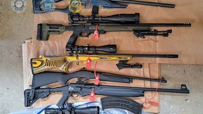 Unregistered assault rifles, smoke grenade and 10,000 rounds of ammunition found in Perth home