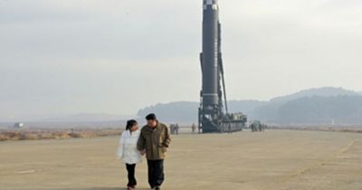Kim Jong-un pictured with daughter for first time as family watch missile launch