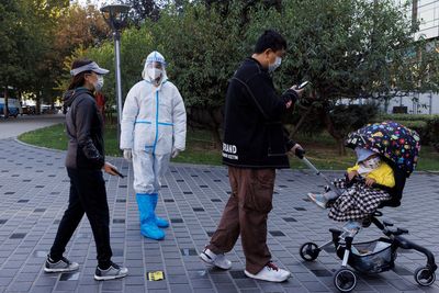 China reports 24,473 new COVID cases; some Beijing businesses shut
