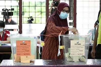 Malaysia polls close with ruling party and Anwar in close race