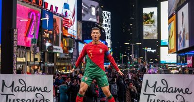 Manchester United's Cristiano Ronaldo greets waxwork figure in Times Square