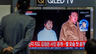 Kim Jong-Un reveals daughter during a ballistic missile launch