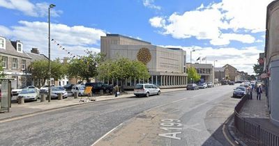 Man rushed to hospital as cops tape off street in East Lothian