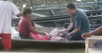 Moment pregnant woman gives birth to baby in a canoe after failing to reach hospital