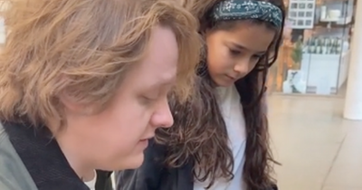 Sweet moment Lewis Capaldi teaches young fan his new song on train station piano