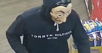 Masked man wanted over terrifying money heist: armed with gun and knife