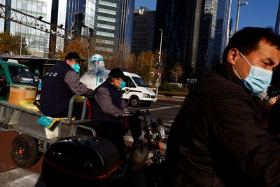 China COVID cases rise, hard-hit Beijing tightens entry rules