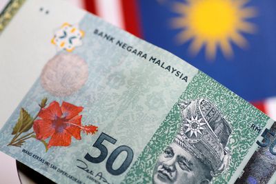 Malaysian currency, stocks fall as vote ends in hung parliament