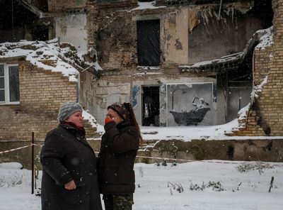 In cold Ukraine village, Banksy mural offers warm bath