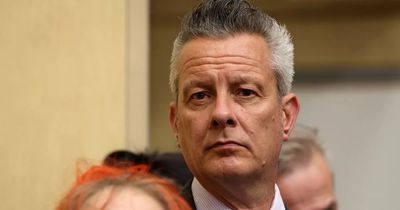 Council denies doing Government's 'dirty work' after hecklers challenge £23m budget cut plans