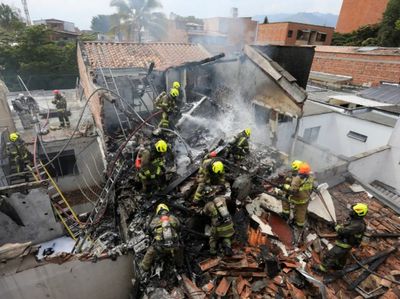 Small plane carrying eight people crashes into residential area of Colombia killing all onboard