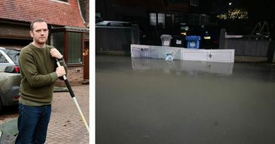 Residents blockade homes after waking up to find their driveways submerged and street flooded