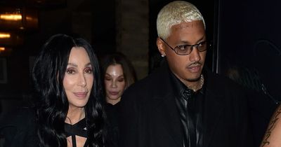 Cher, 76, holds hands with new beau Alexander Edwards, 36, as they step out in Malibu