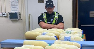 Picture of police officer with stolen milk makes women thirsty