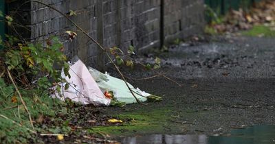 Floral tributes for tragic boy, 17, left at scene as murder probe continues