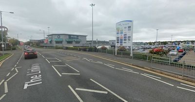 Woman dies after falling unconscious at retail park