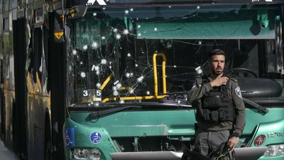 Twin blasts near bus stops shake Jerusalem, killing a teen and hurting 18 other people