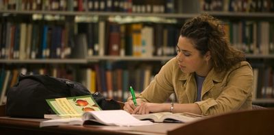 Don't cut them off: low-performing students benefit from continued access to loans