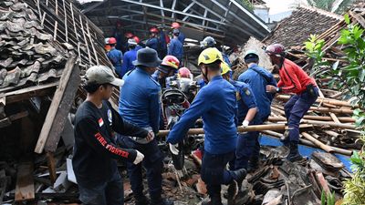 Rescuers in Indonesia pull six-year-old boy from rubble after deadly quake
