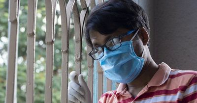 China expands lockdowns as Covid-19 cases hit daily record