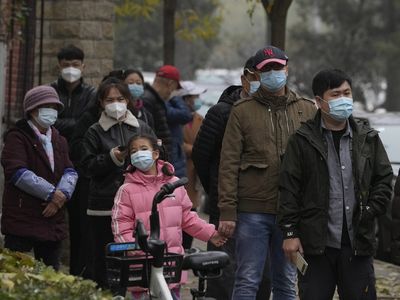 China expands lockdowns as COVID-19 cases hit daily record