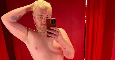 Sam Smith goes shirtless as they show off their tattoos in changing room selfie snap