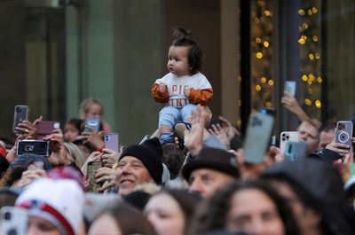 Americans celebrate Thanksgiving under shadow of two more mass shootings