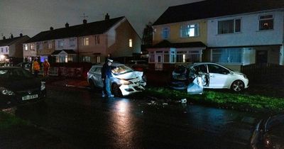 Smoke 'filled road' as car smashed into parked vehicles