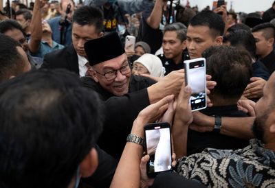 Malaysia's Anwar begins work as PM after polarising election