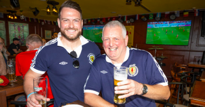 Hearts-daft father and son flying flag for Scotland at World Cup in Qatar