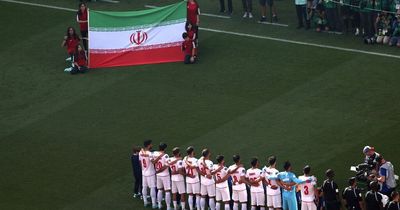 Iran players sing anthem before World Cup clash with Wales as song met by jeers from fans