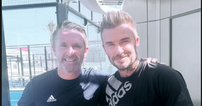 Robbie Keane rubs shoulders with David Beckham while in Qatar for World Cup