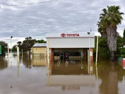 Locals muck in as flood cuts off tiny town