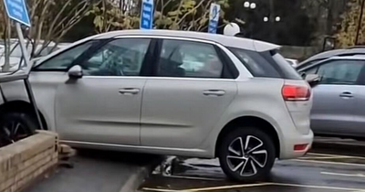 Car caught ploughing through Edinburgh shopping centre wall