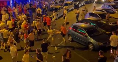 Wales and England fans appear to clash in ugly fight as punches and chairs thrown outside Tenerife bar